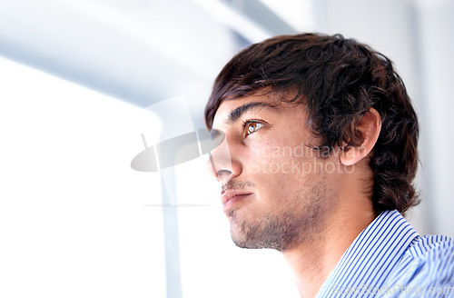 Image of Man, window and thinking of career in workplace and wellness with job growth as IT professional. Young person, thought and vision for entrepreneurship, geek and tech start up idea for silicon valley