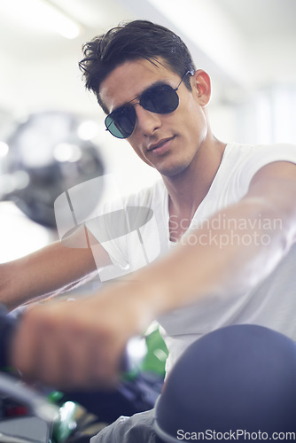 Image of Portrait, man and motorcycle with sunglasses, cool and travel with training, riding and journey. Face, person and biker with stylish outfit, fun and casual eyewear with extreme sport or adventure