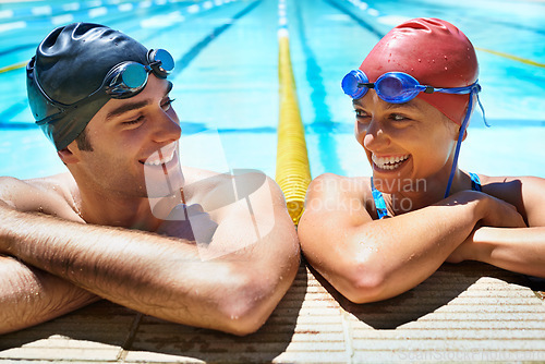 Image of Swimming pool, happy and friends relax after sports exercise, workout routine or training in water. Swimmer, humour and team partner laughing after fitness, cardio or challenge performance