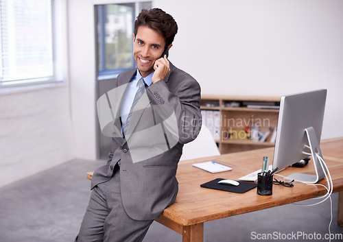 Image of Businessman, portrait and phone call in office by desk, communication and desktop on table in corporate career. Professional, person and smile face on mobile, technology and networking in formal suit