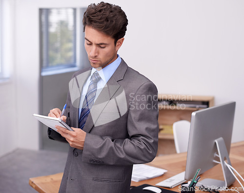 Image of Business man, writing notes and planning in office with ideas, brainstorming and financial strategy in accounting. Professional accountant or corporate employee with notebook for schedule or priority