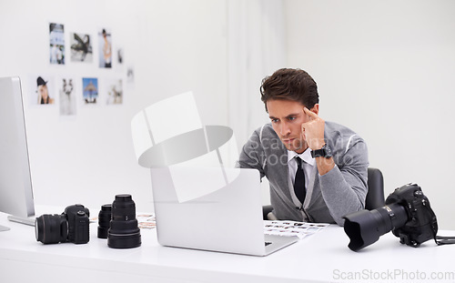 Image of Photographer, working and editing on computer in office with technology, software and thinking. Professional, editor and creative person learning on laptop with photoshoot results or cinematography