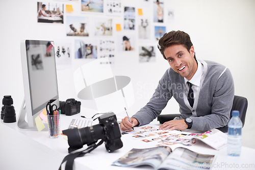 Image of Man, camera and photography in agency with portrait, checking image design and creative in workplace. Person, smile face and glasses for vision, technology and focus in office with digital photoshoot