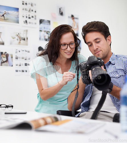 Image of Camera, office and photographer team looking at photoshoot in a studio or workshop for production. Creative, photography and young artists with dslr equipment for picture inspection in workplace.