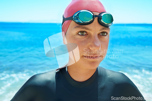 Image of Swimmer sport, face and woman at sea outdoor in summer for exercise, training or workout. Ocean, athlete and person in goggles in nature for fitness, health or triathlon competition at beach water