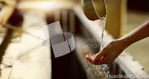 Image of Shinto temple, closeup and washing hands with water in container for cleaning, faith and wellness. Religion, mindfulness and purification ritual to stop evil, bacteria and peace at shrine in Tokyo