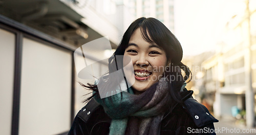 Image of Happy, laughing and face of Asian woman in the city on vacation, adventure or weekend trip. Smile, travel and portrait of excited young female person with positive attitude in urban town on holiday.