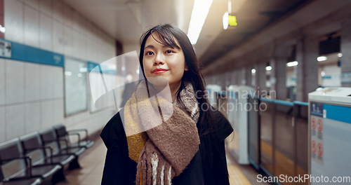 Image of Smile, walking and young woman at train station for exploring on vacation, adventure or holiday. Happy, travel and beautiful Asian female person by public transport for sightseeing on weekend trip.