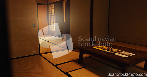 Image of Interior, dojo or house in Japan of temple, tradition or culture with wooden table and structure. Empty room of Japanese home, furniture or building in Tokyo with carpet, tatami mat or bamboo floor