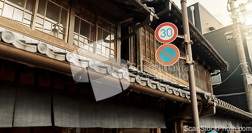 Image of Architecture, building and road sign on street for city, traditional infrastructure and culture in urban town. Tourism, neighbourhood and signal, symbols and icon for traffic in Japan for travel