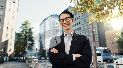 Image of Japanese lawyer man, portrait and city with arms crossed, pride and smile for job at legal agency. Person, attorney or advocate with suit, street and happy on metro sidewalk, road or outdoor in Tokyo