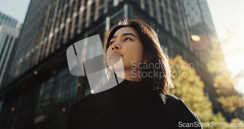 Image of Walking, building and Japanese woman in city for tourist sightseeing in the street on weekend trip. Travel, adventure and bottom view of young female person commuting in road of town in Kyoto Japan.