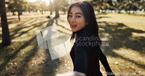Image of Japanese woman, pov and hand on walk, portrait and smile in park to show path, nature and trees. Girl, person and outdoor with grass, lawn and plants for freedom, adventure or travel journey in Tokyo