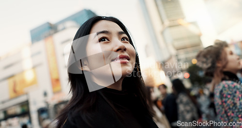 Image of Walking, happy and Japanese woman in the city for tourist sightseeing in the street on weekend trip. Smile, adventure and young female person commuting for travel in road of urban town in Kyoto Japan