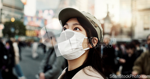 Image of Virus, Japan and woman in travel with face mask for health and on city background. Compliance, safety for japanese female person outdoors with facial protection for corona or covid pandemic on street