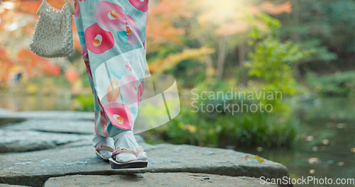 Image of Walking, lake or legs of woman in nature for journey on holiday vacation for freedom or wellness. Park, travel or feet of Japanese person on rocks for health, peace and inspiration to relax in forest