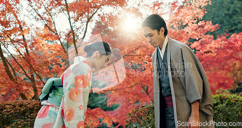 Image of People in park in Japan, bow and traditional clothes with hello, nature and sunshine with respect and culture. Couple outdoor together in garden, greeting with modesty and tradition, polite and kind