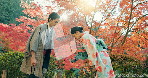 Image of People in park in Japan, bow and traditional clothes with hello, nature and sunshine with respect and culture. Couple outdoor together in garden, greeting with modesty and tradition, polite and kind