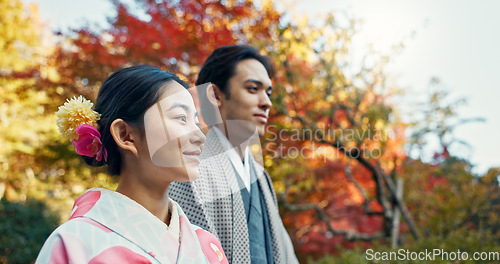 Image of Asian couple, walking in garden and sunshine, peace and thinking about life, reflection and date in nature. Travel, people together in Japanese park for fresh air and calm with love, care and trust