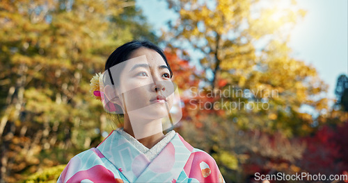 Image of Woman in garden, Asian and calm with fan, thinking about life with reflection and tranquility in traditional clothes. Peace Japanese park and nature for fresh air with inspiration or insight
