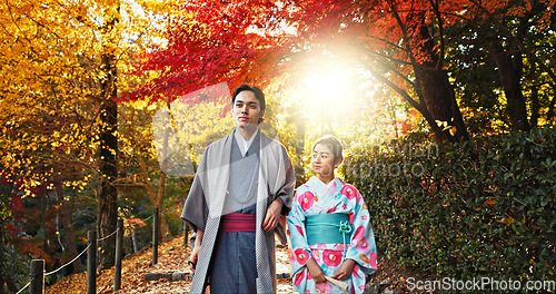 Image of Japanese people in park, walking and traditional clothes with path, nature and sunshine with respect and culture. Couple outdoor together in garden, date or commitment with love, bonding and calm