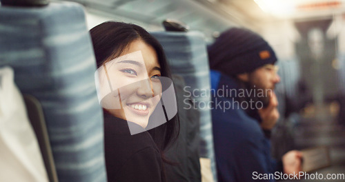 Image of Smile, face and young Asian woman on a train for public transportation to work in the city. Happy, portrait and female person with positive, confident and good attitude for commuting to office.