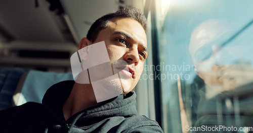 Image of Thinking, sad and young man on train with mental health problem or loneliness on trip or journey. Depression, upset and male person from Canada on public transportation for vacation or holiday.