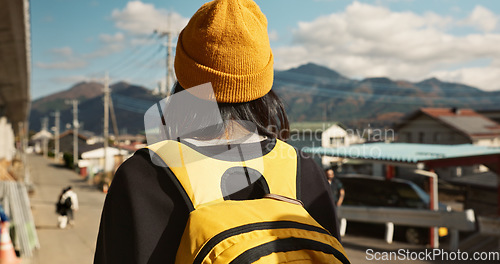 Image of Asian, woman at train station and travel, back view on commute or holiday and freedom outdoor. Railway, walking on platform and transportation, journey for adventure in China and weekend trip