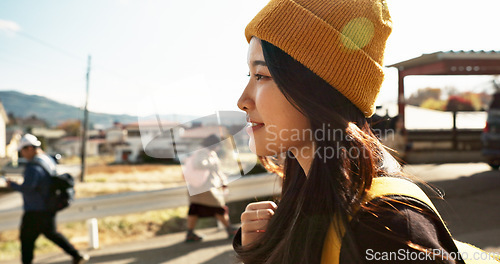 Image of Asian, woman at train station and travel, commute or holiday and freedom outdoor with profile. Railway, walking on platform and transportation, journey for adventure in China and weekend trip