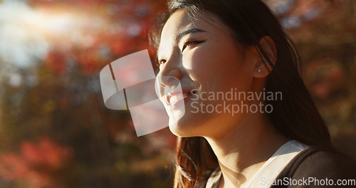 Image of Outdoor, thinking and Asian woman with a smile, nature and forest with joy, daydreaming and holiday. Japanese person sunshine or girl with summer, travel or peace with vacation. calm or weekend break