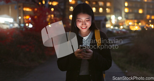 Image of Asian woman, phone and night for communication, social media or outdoor networking in city. Female person walking with mobile smartphone in late evening for online chatting in urban town of Japan