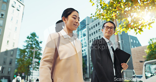 Image of Walking, conversation and business people in the city talking for communication or bonding. Smile, discussion and professional Asian colleagues speaking and laughing together commuting in town.