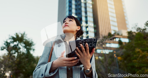 Image of Happy asian woman, tablet and city for social media, research or communication in outdoor networking. Business female person smile on technology in online search, chatting or texting in an urban town