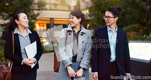 Image of Walking, conversation and business people in the city talking for communication or bonding. Smile, discussion and professional Asian colleagues speaking and laughing together commuting in town.