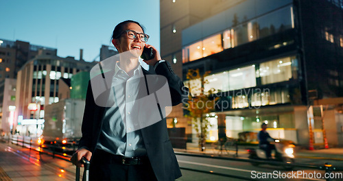 Image of Businessman, phone call and night in city for conversation, laughing or outdoor travel. Happy asian man or employee smile and talking on mobile smartphone in late evening for discussion in urban town