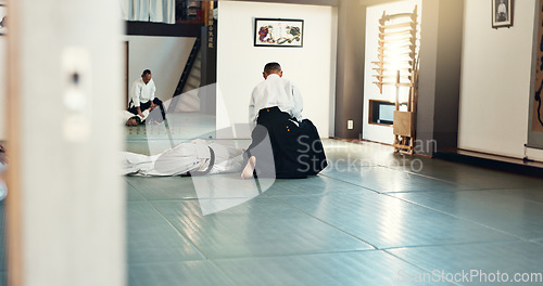 Image of Students, karate or man teaching martial arts in dojo for fitness, discipline or self defense for combat Demonstration, workout or kung fu master training a person for fighting, education or class