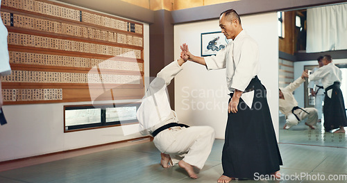 Image of Sensei, students and fight, aikido for fitness and martial arts training class with self defense and discipline. Combat, education and black belt with Japanese men and workout for exercise in dojo
