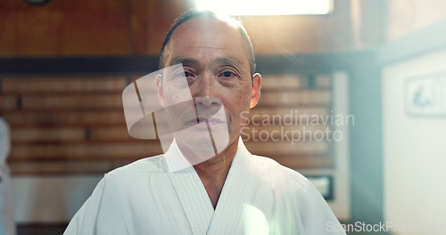 Image of Sensei, aikido and training dojo for martial arts practice or Japanese traditional sport, fighting or health. Male person, gee uniform and face for fitness challenge or power, champion or confidence