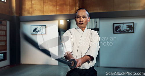 Image of Aikido sword, martial arts and mature man training, self defense or practice combat technique. Dojo discipline, Japanese samurai or warrior with weapon for skills development, attack or katana strike