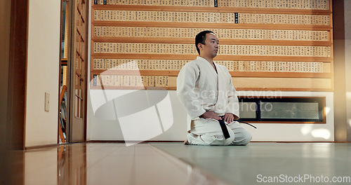 Image of Martial arts man, bow and floor for fight, training or respect with honor for conflict, competition or dojo. Athlete, Japanese person and preparation for aikido with exercise, workout or discipline