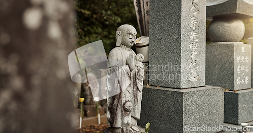 Image of Buddha, statue and tombstone in graveyard with culture for safety, protection and sculpture outdoor in nature. Jizo, Japan and memorial gravestone with history, tradition and monument for sightseeing