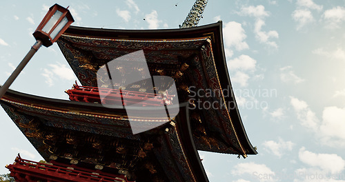 Image of Building, architecture and Japanese temple, culture and outdoor for travel, low angle and worship. Landscape, tourism and Fushimi Inari Taisha Shrine in Kyoto, traditional landmark and pagoda