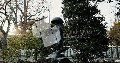 Image of Japan, warrior and statue in nature or outdoor cemetery for honor, tradition or culture. Structure of old soldier or historical Fushimi Inari Taisha shrine of knight, god or hero for symbol in Kyoto