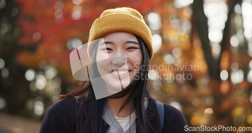 Image of Woman, forest and portrait in Kyoto, garden and tourist with happiness, traditional history and travel. Nature, japanese culture and explore in woods with trees, adventure and holiday walk in autumn