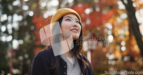 Image of Woman, forest and travel in Kyoto, garden and tourist with happiness, traditional history and sightseeing. Nature, japanese and explore in woods with trees, adventure and holiday walk in autumn