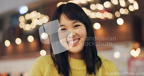 Image of Woman, Japanese and portrait in street for travel Tokyo for city destination, journey or happy. Female person, face and smile or road outdoor as light bokeh or holiday adventure, vacation or downtown