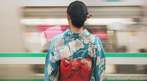 Image of Woman, japan and train station, kimono and travel with public transport, metro bullet in city. Person, journey or traditional clothes in motion blur on weekend or commute in tokyo on adventure