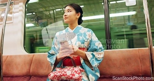 Image of Woman, japanese and train, phone and kimono with travel, public transport and metro bullet in city. Person, journey or traditional clothes for fashion, weekend and commute in tokyo on adventure