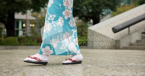 Image of Person, Japanese and feet walking in kimono in city or local commute or traditional, outdoor or downtown. Legs, sandals and Tokyo street or urban road journey as healthy wellness, culture or trip
