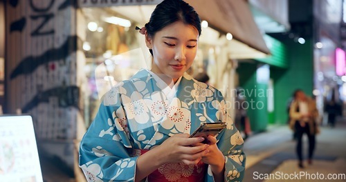 Image of Street, Japanese woman and cellphone with typing, internet or social media with traditional clothes. Person, outdoor or girl with smartphone, mobile user or contact with network, smile or digital app